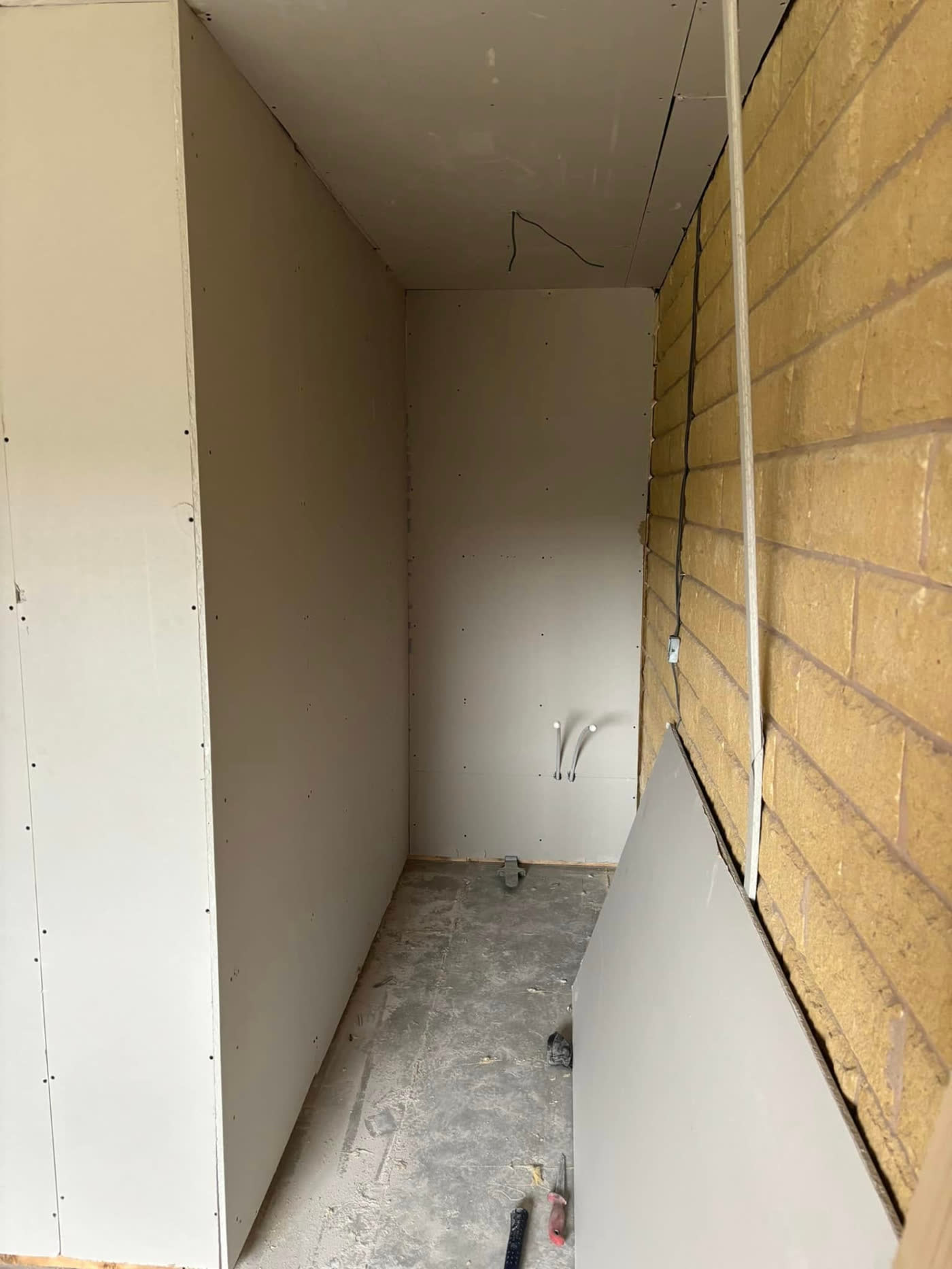 Stud wall boarded out in plasterboard during a joinery and carpentry job by MB Roofline & Joinery in Bury
