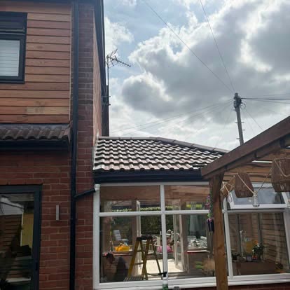 Conservatory fitted with a new insulated tiled warm roof matching the main house tiles